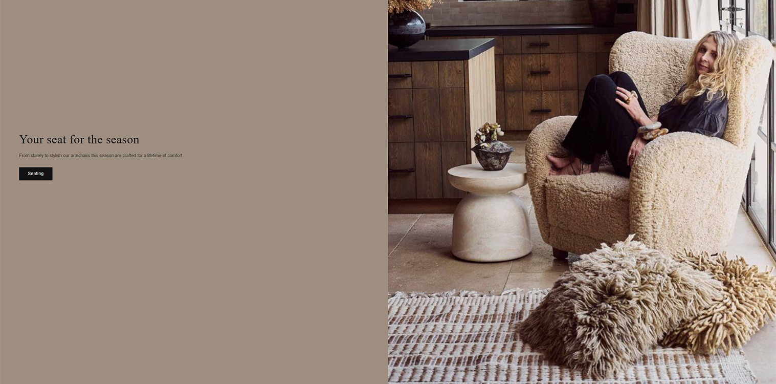 Cozy living room scene featuring a woman relaxing in a stylish, plush armchair with a textured throw pillow on a woven rug, complemented by a modern side table and a warm, inviting kitchen backdrop. Perfect for showcasing seasonal comfort and contemporary interior design.