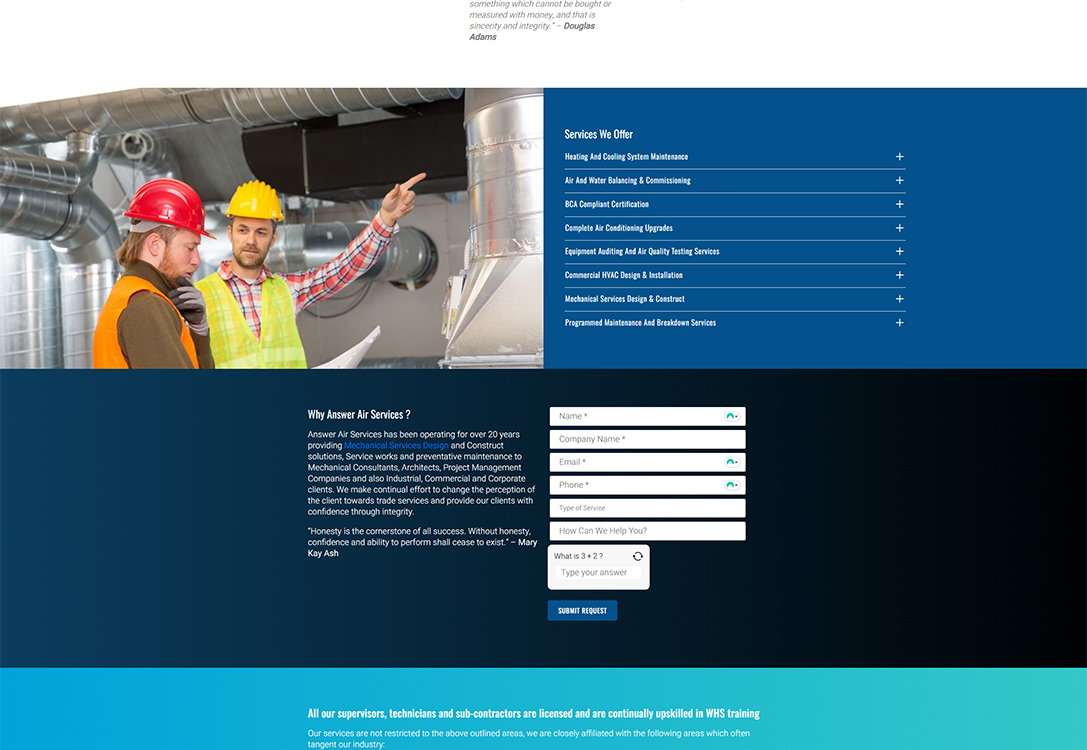 Two construction workers in safety helmets discuss HVAC system installation in a mechanical service environment, showcasing collaboration in air conditioning and ventilation services.