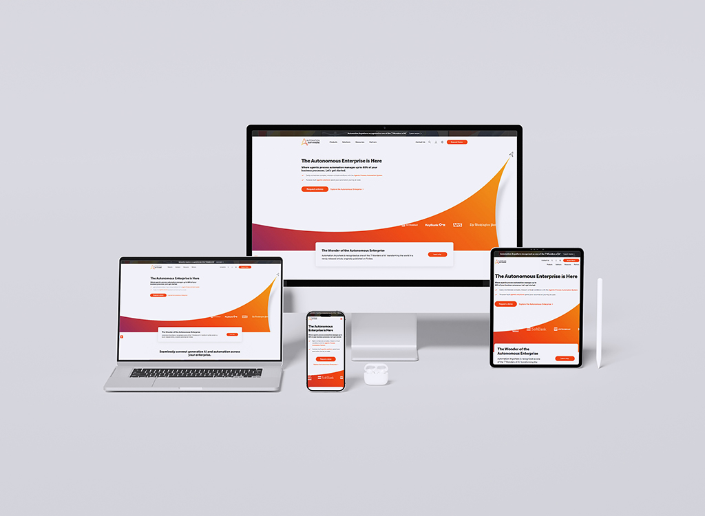 A collection of devices including a desktop monitor, laptop, tablet, and smartphone displaying the homepage of 