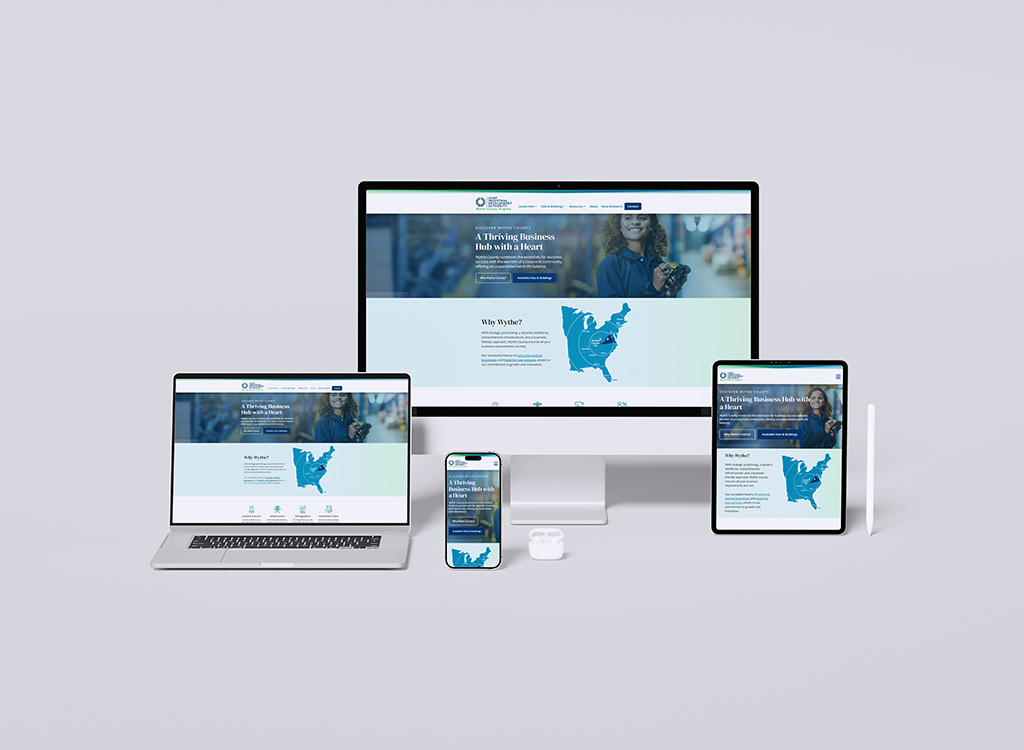Image showcasing a responsive website design displayed on multiple devices, including a desktop monitor, laptop, tablet, and smartphone, featuring a business-focused homepage with a map of the United States and a tagline about being a thriving business hub. Ideal for illustrating digital marketing and web development services.