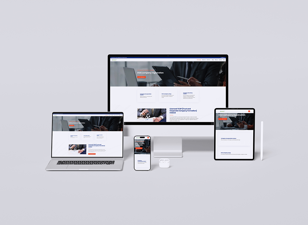 A modern workspace setup featuring a desktop computer, laptop, tablet, and smartphone, all displaying a professional website focused on Irish company registration services. The devices showcase a clean, user-friendly design with clear navigation and engaging content.