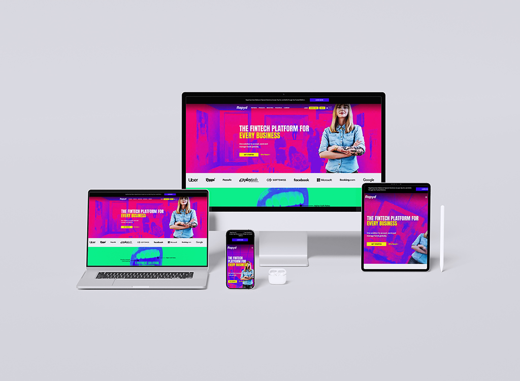 Responsive design showcasing the Rapyd fintech platform on multiple devices, including a desktop, laptop, tablet, and smartphone, featuring a vibrant color scheme and a prominent tagline emphasizing its versatility for all businesses.