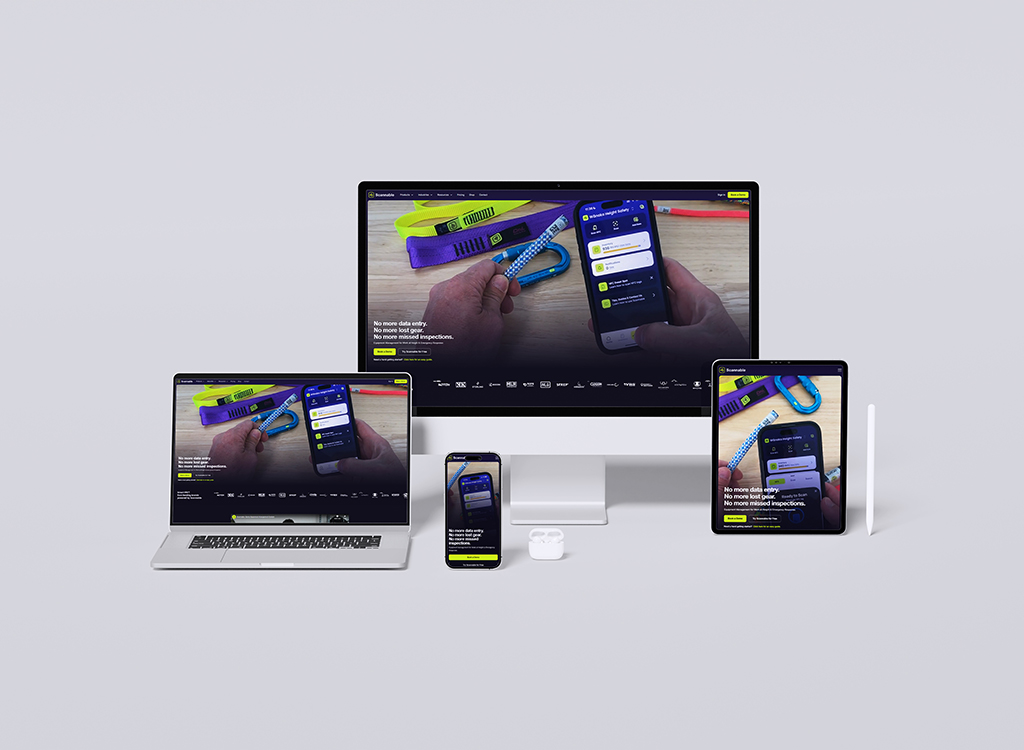 Image showcasing multiple devices including a desktop monitor, laptop, tablet, and smartphone displaying a mobile application interface for data management and inspections, with colorful accessories in the background.