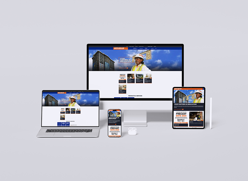 Image showcasing a responsive website design displayed on multiple devices, including a desktop monitor, laptop, tablet, and smartphone. The website features a construction theme with a professional wearing a safety vest, highlighting products and services related to the construction industry.