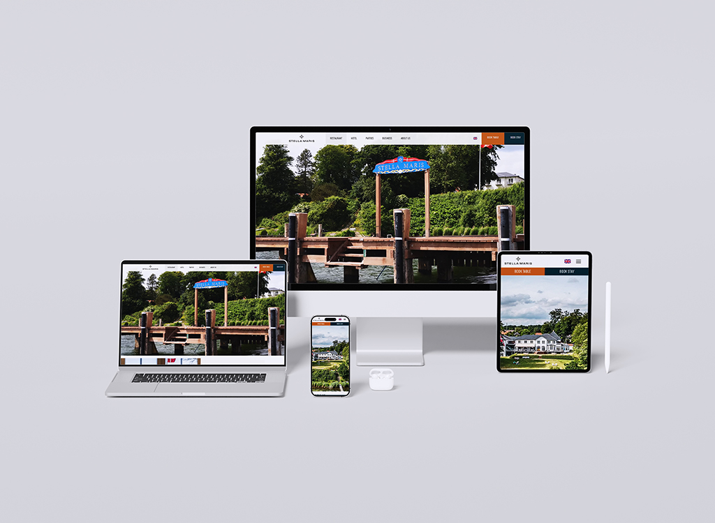 Image of multiple devices displaying the website for Stella Maris, featuring a scenic view of a dock and lush greenery. The desktop, laptop, tablet, and smartphone showcase the responsive design and user-friendly interface of the site, ideal for booking stays and exploring amenities.