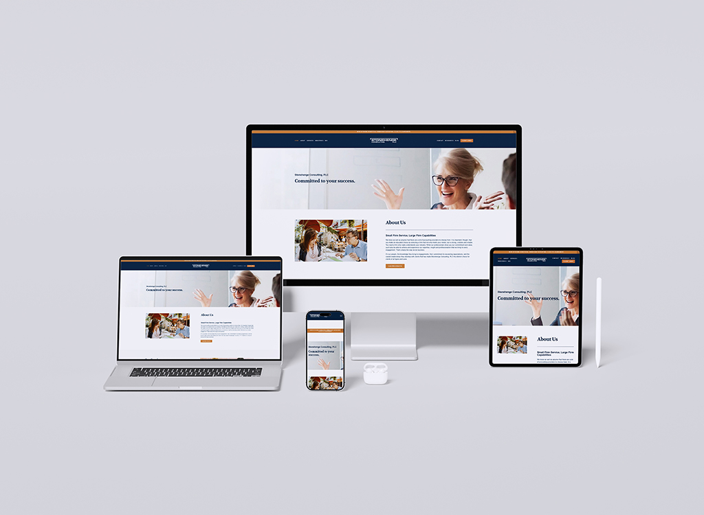 Image showcasing a responsive website design displayed on multiple devices including a desktop computer, laptop, tablet, and smartphone, featuring a professional consulting firm's homepage with a focus on client success and services offered.