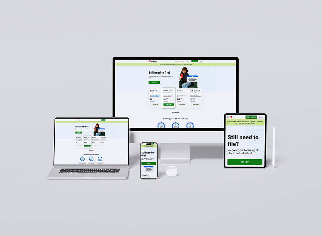 A collection of devices displaying a tax filing website, including a desktop computer, laptop, tablet, and smartphone, showcasing various filing options and pricing plans for users.